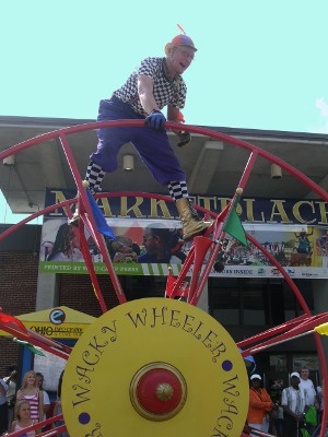 [Close up view of man and the wheel.]